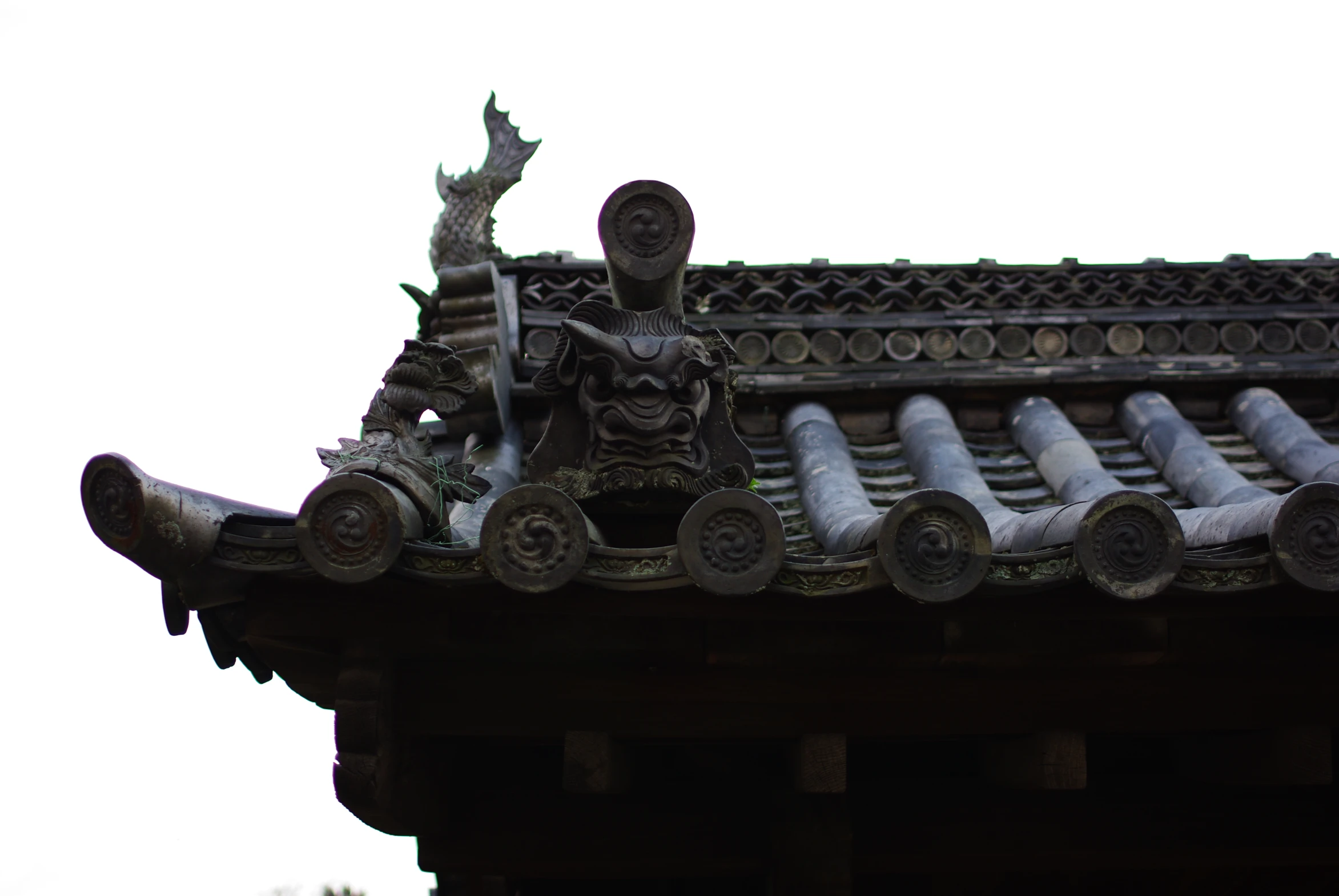 the roof of an old building with decorative gargoyles