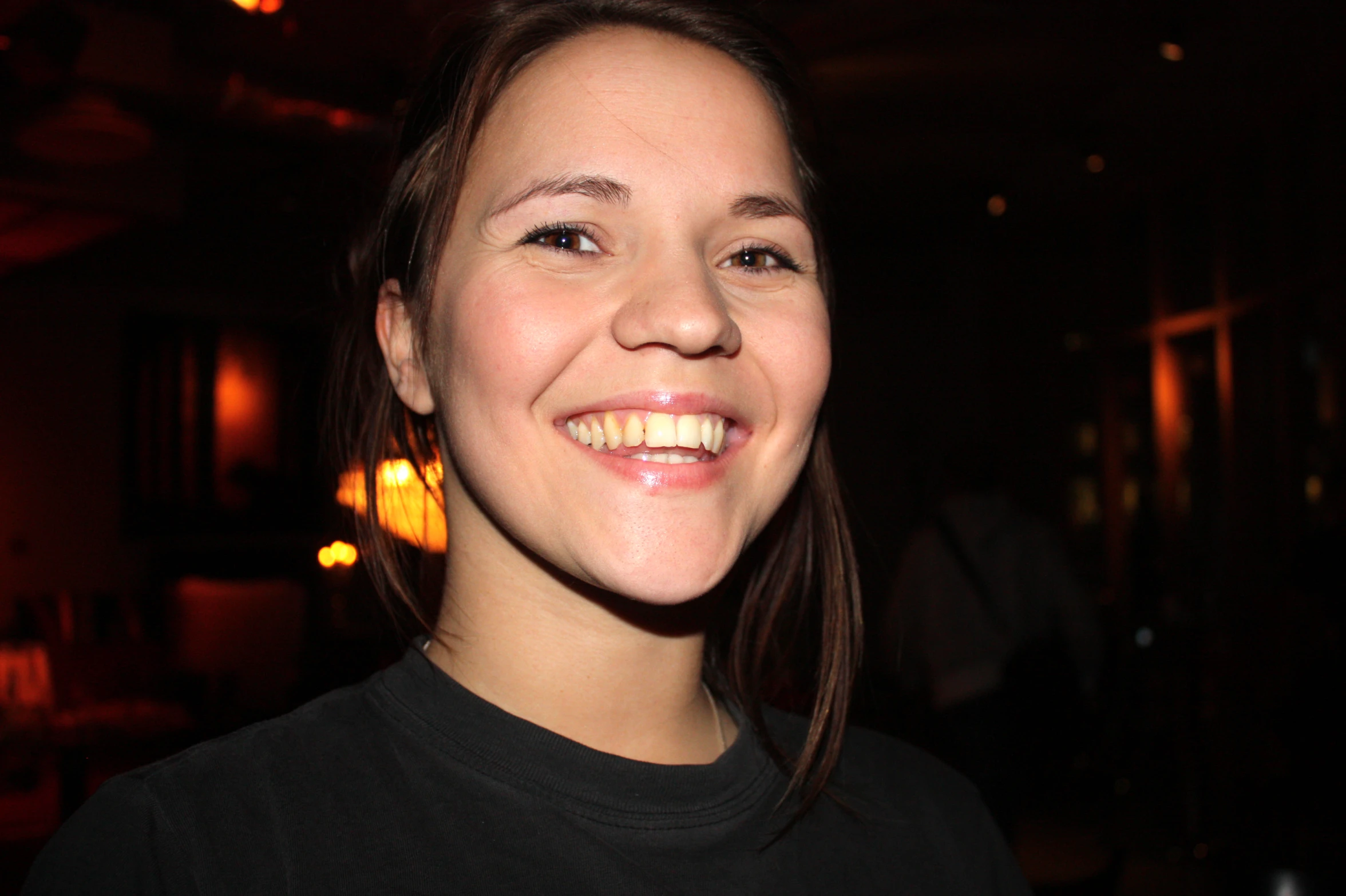 a close up of a woman with a toothbrush