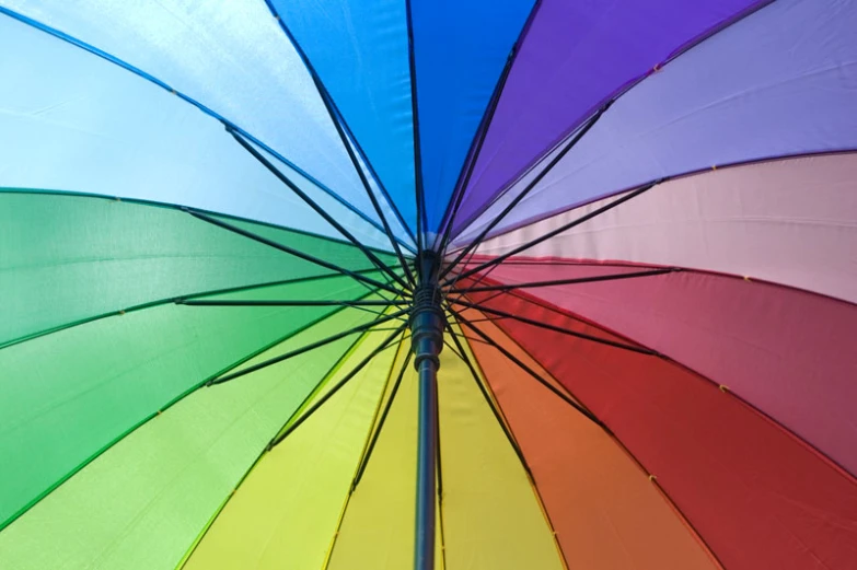 a multicolored umbrella has an interesting pointy design