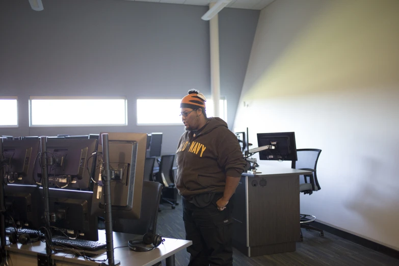 a man wearing a hat in an office setting