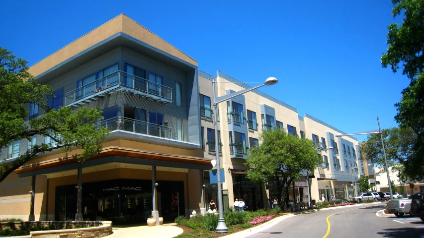 a large building with an air bale next to a street