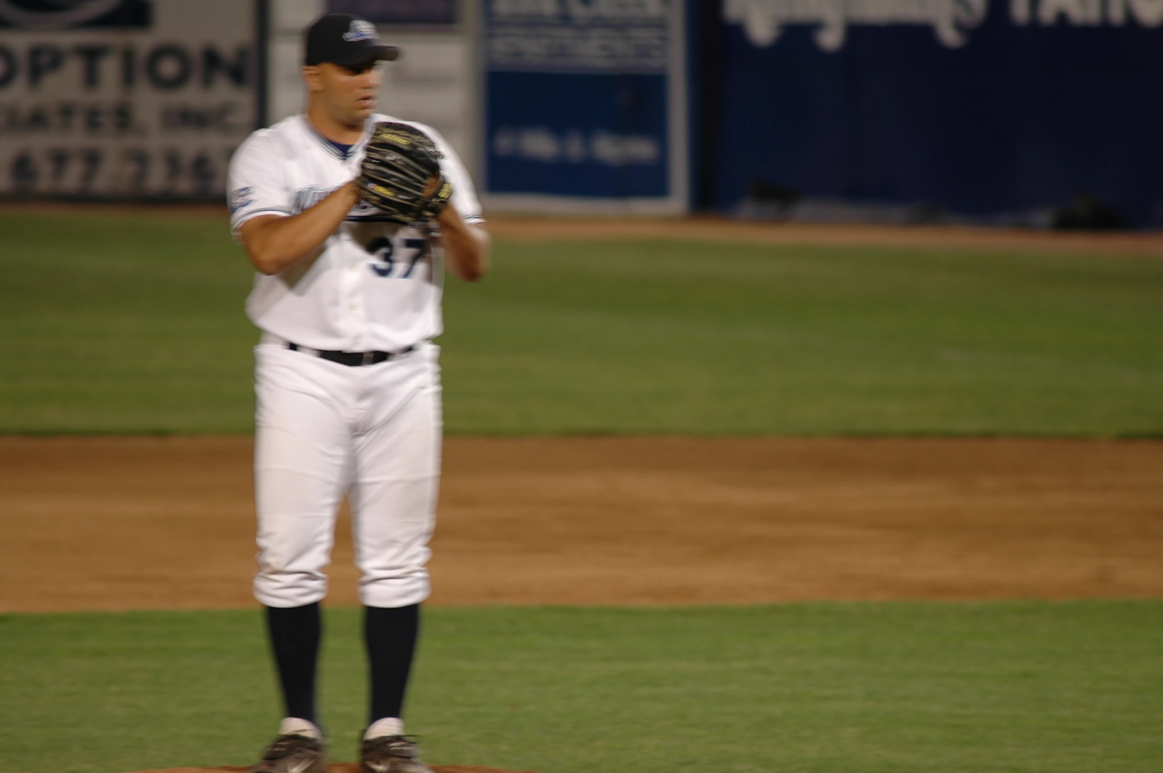 a baseball player is on the field with his glove
