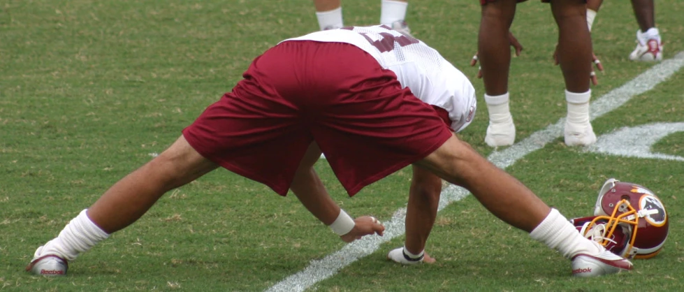 two players diving down to play a game of frisbee