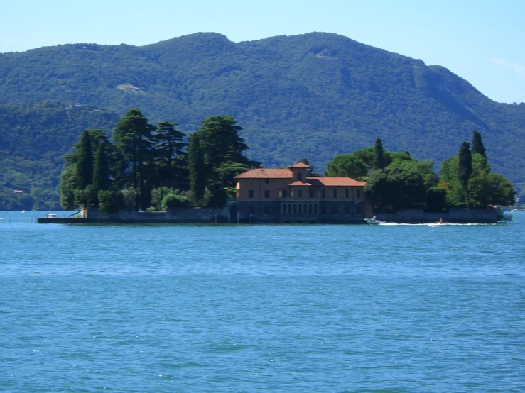 a house on an island in the middle of the ocean