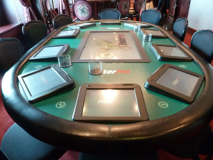 the tabletop of a large conference table at a el