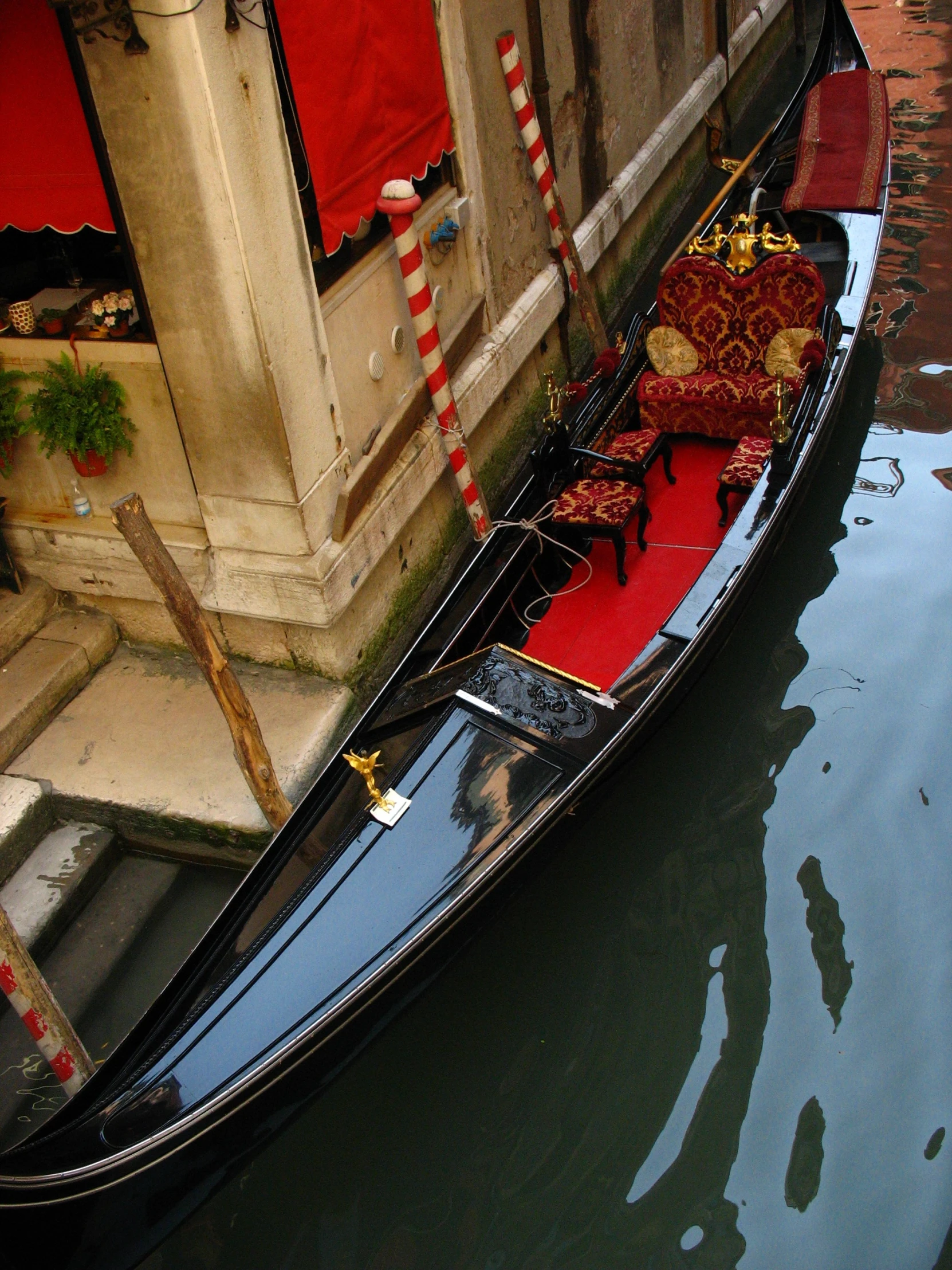 a gondola with a red carpet going down the street