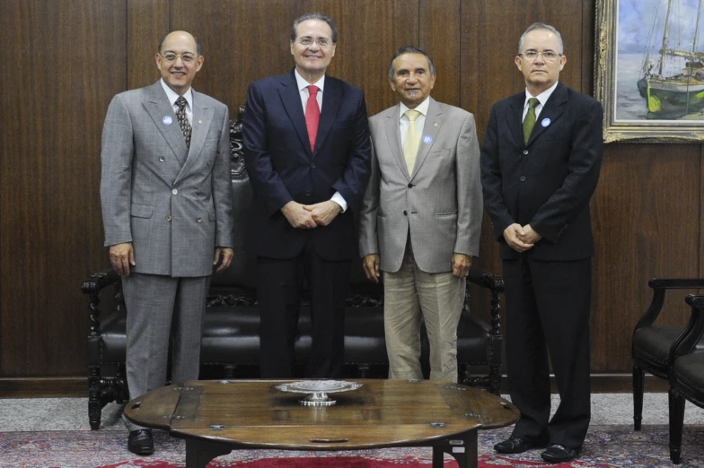 five business men in suits posing for a po