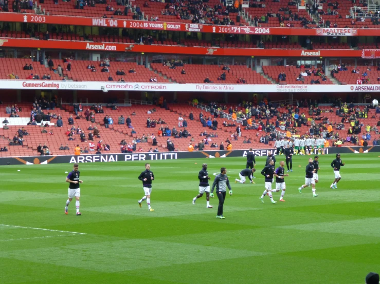 a group of players play a game on a football field