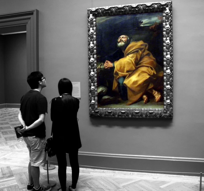 two people are looking at the paintings in an old museum