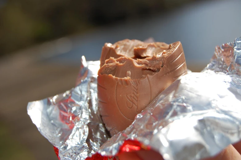 there is a chocolate ice cream sandwich wrapped in foil