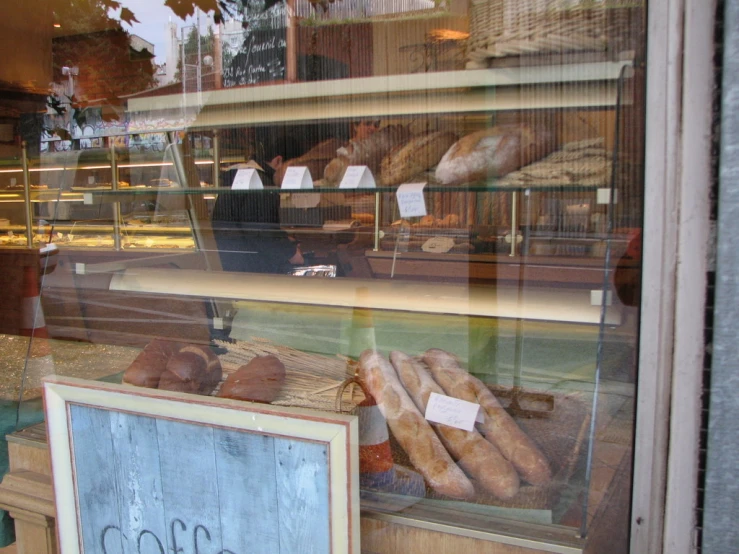 a bakery is seen through the window with pastries in it