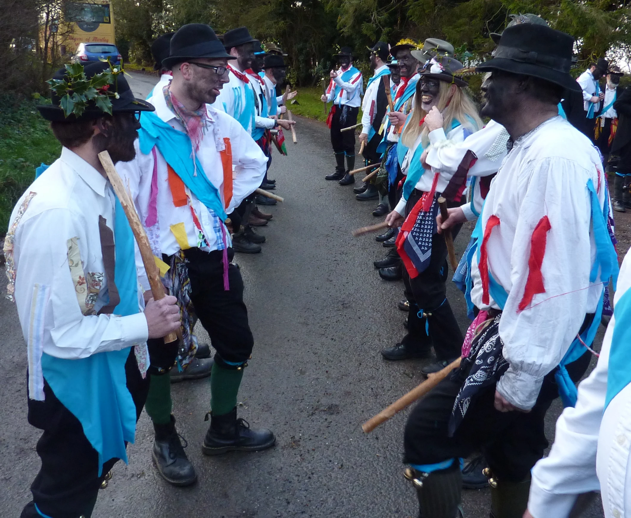 a group of people in costume walking down a street