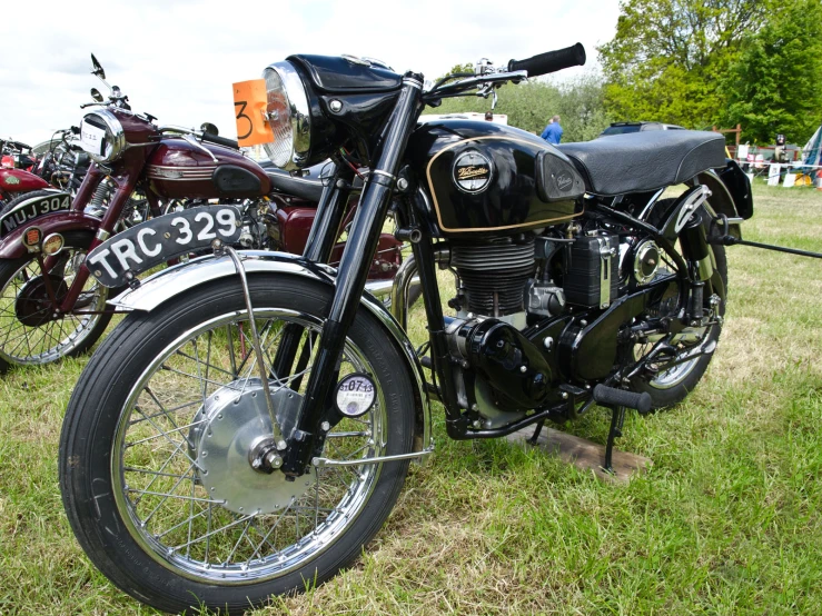 a group of motorcycles that are sitting on the grass