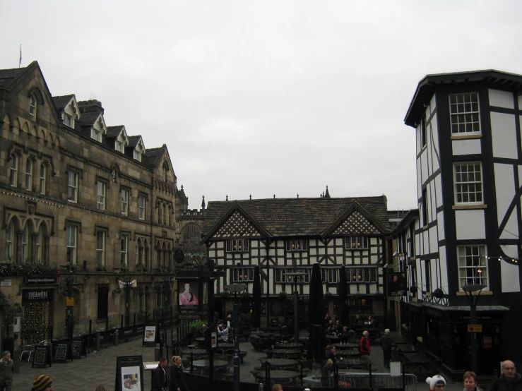 a city street is surrounded by old buildings