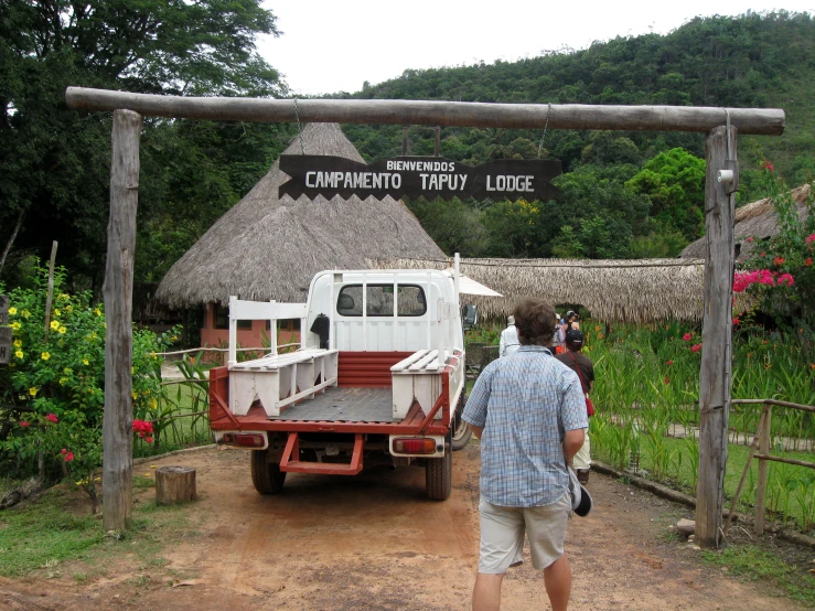 two men are standing in front of a truck