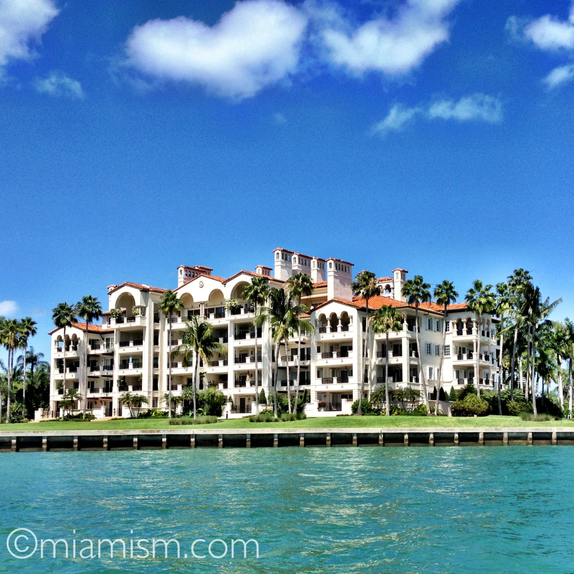 a boat on the water near a large building