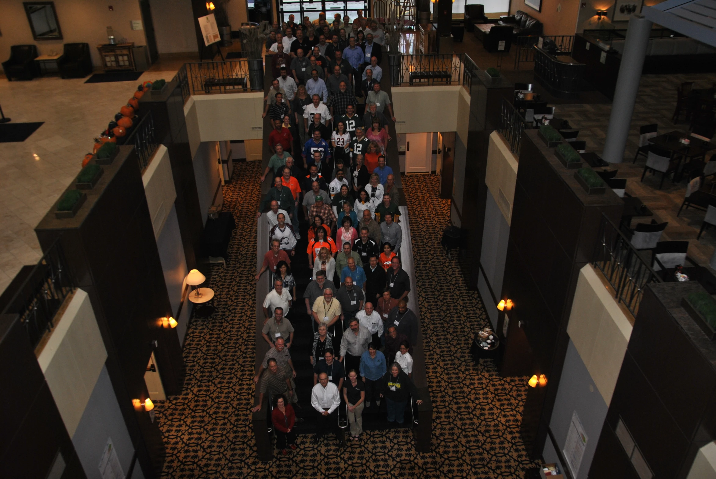 a group of people standing in a large room