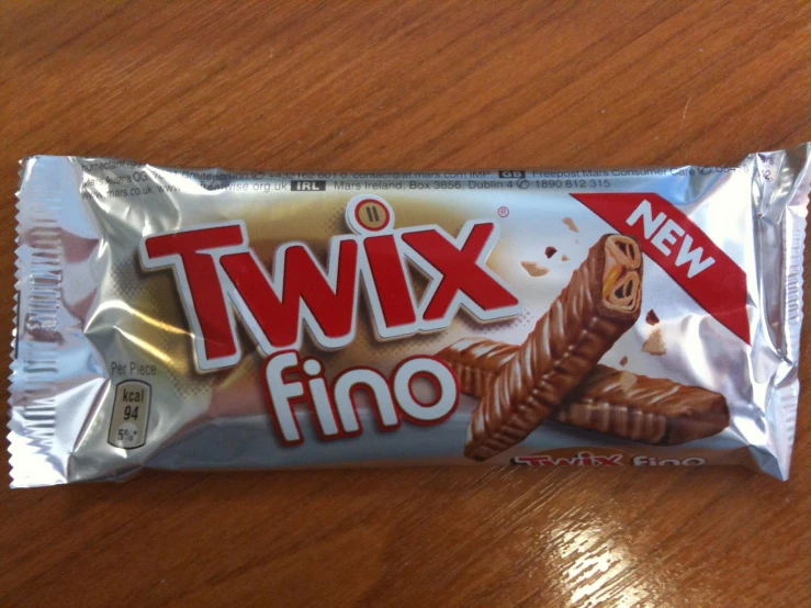 a bar of twix chocolate is on the table