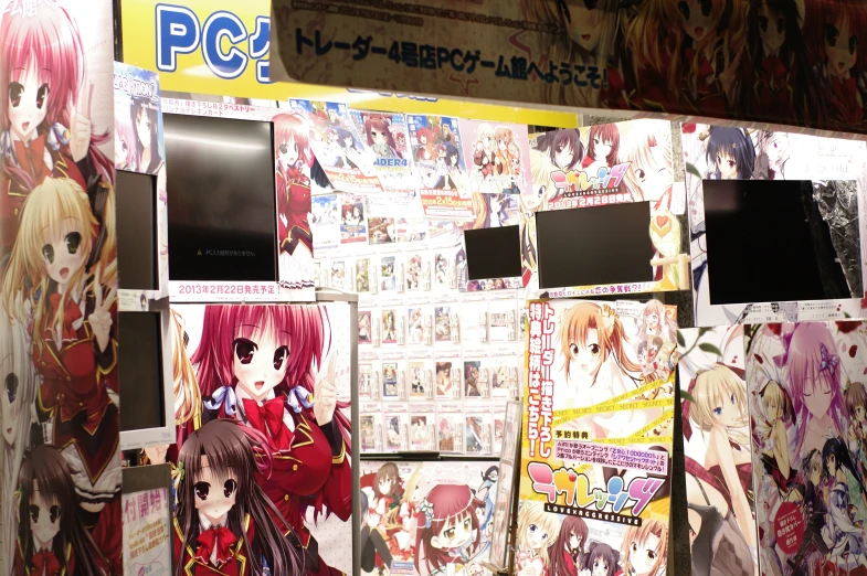 anime posters are posted on the wall near a posterboard