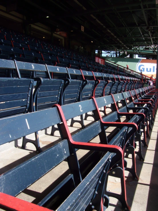 a couple of benches at a baseball stadium