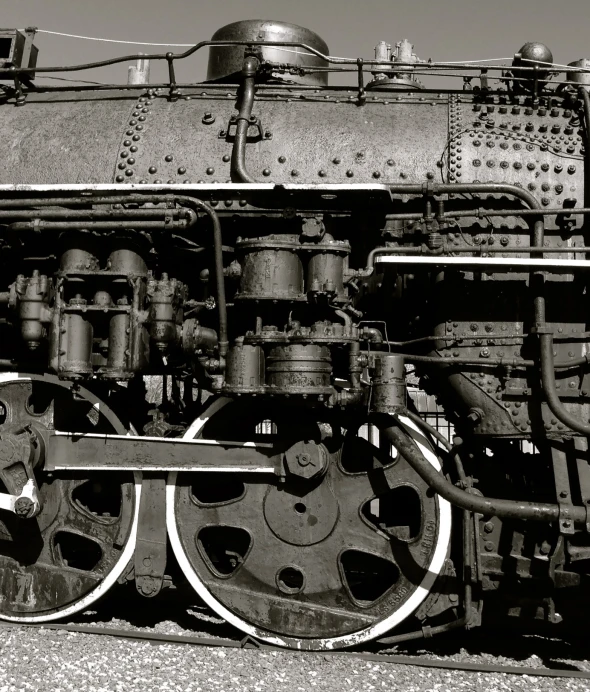 an old locomotive is parked in a black and white po