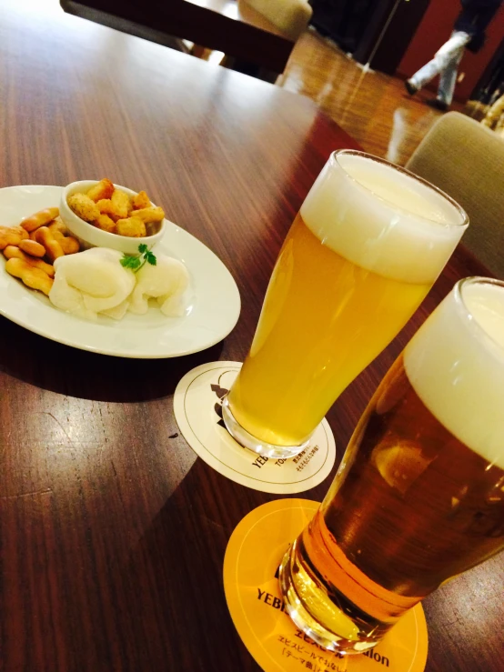 beer and appetizer are served at a restaurant table