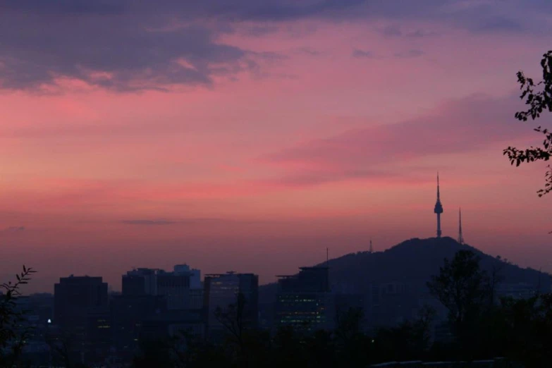 the clouds are pink and purple at sunset