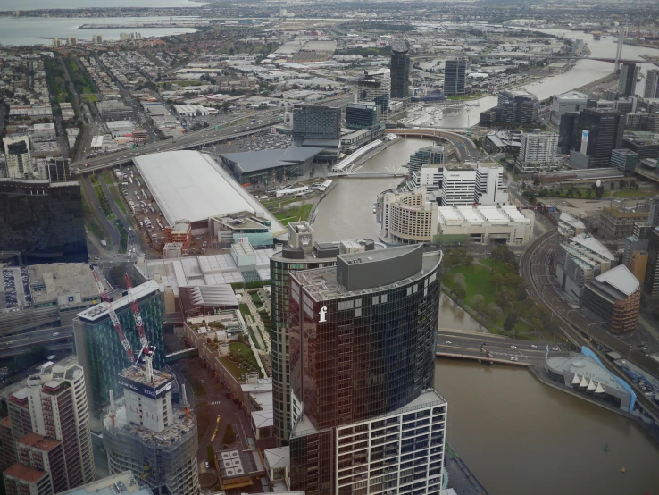 some very tall buildings near the water and a river