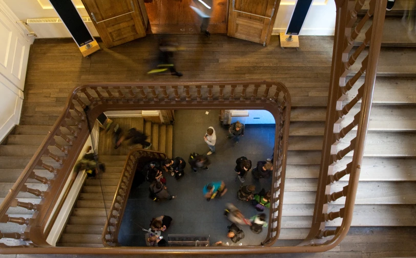 an aerial view of a staircase and doorway from above