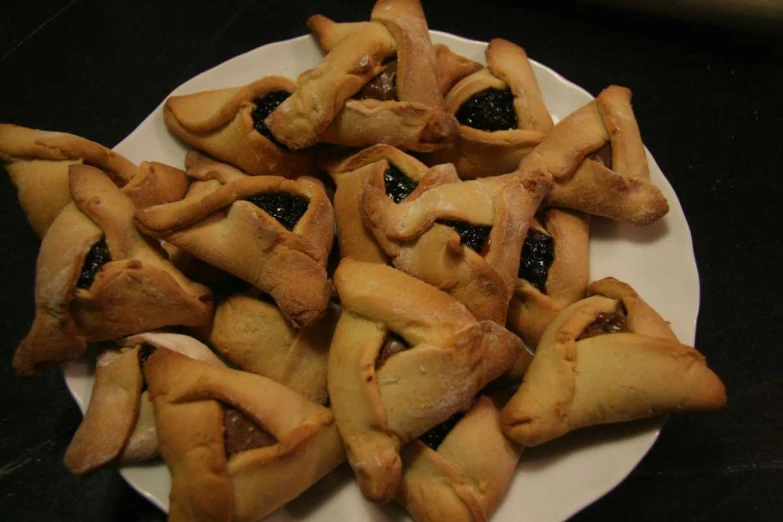 a white plate holding pieces of pie