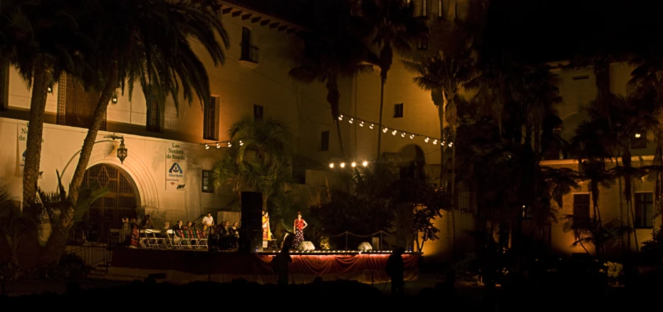 a large el building at night, with string lights