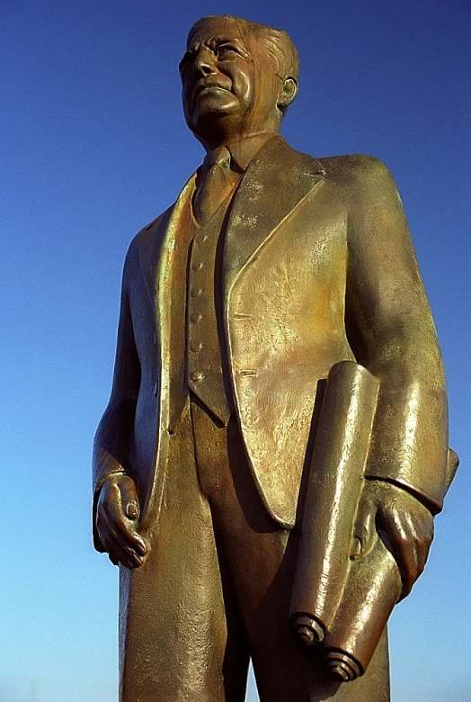 a large statue of a man wearing an unusual suit