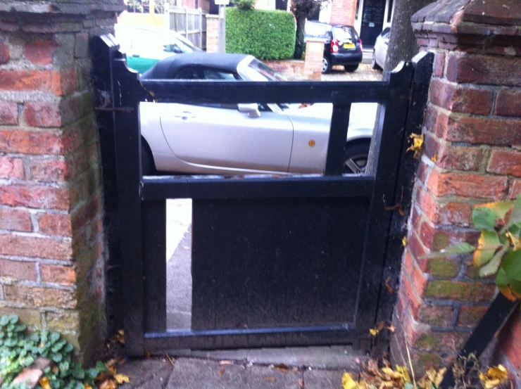 a car is shown stuck into a gate