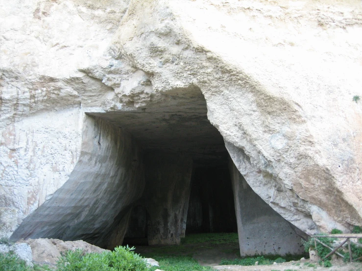 inside a long tunnel of white granite with small holes
