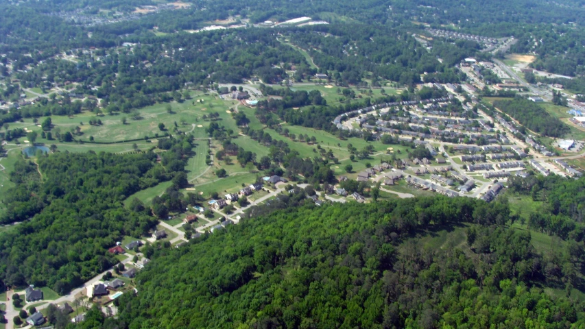 an aerial view of an intersection in the middle of the woods