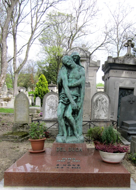 a statue is shown in a cemetery