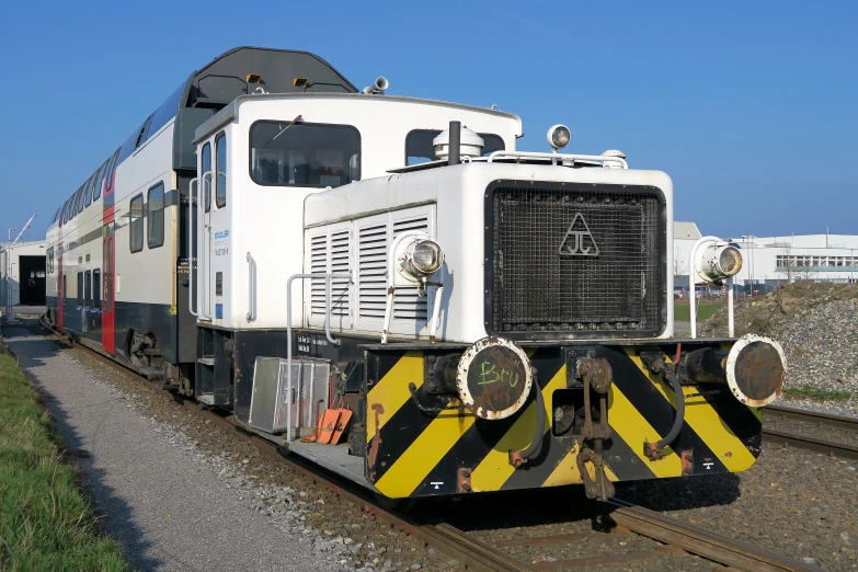 the front end of a cargo train is striped