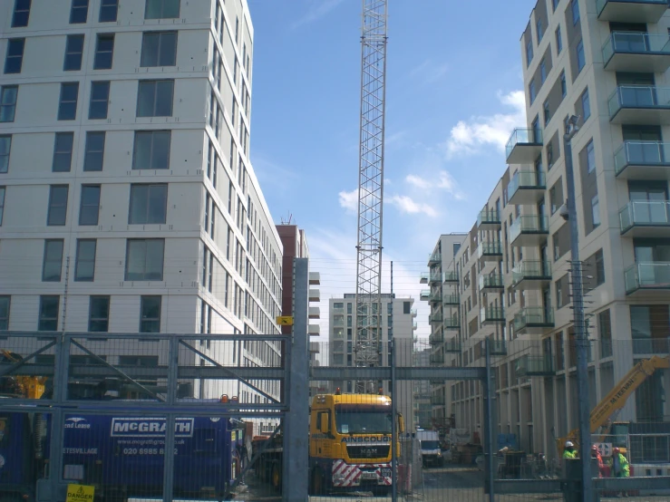 construction work is being carried out in front of apartment buildings