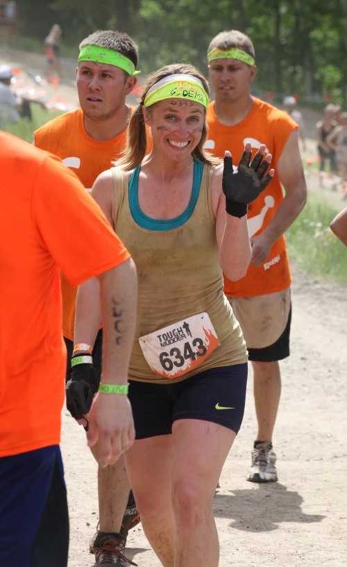 people running in a marathon together on dirt