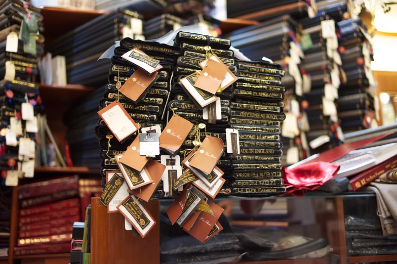 stacks of old books, with many signs and tags on them