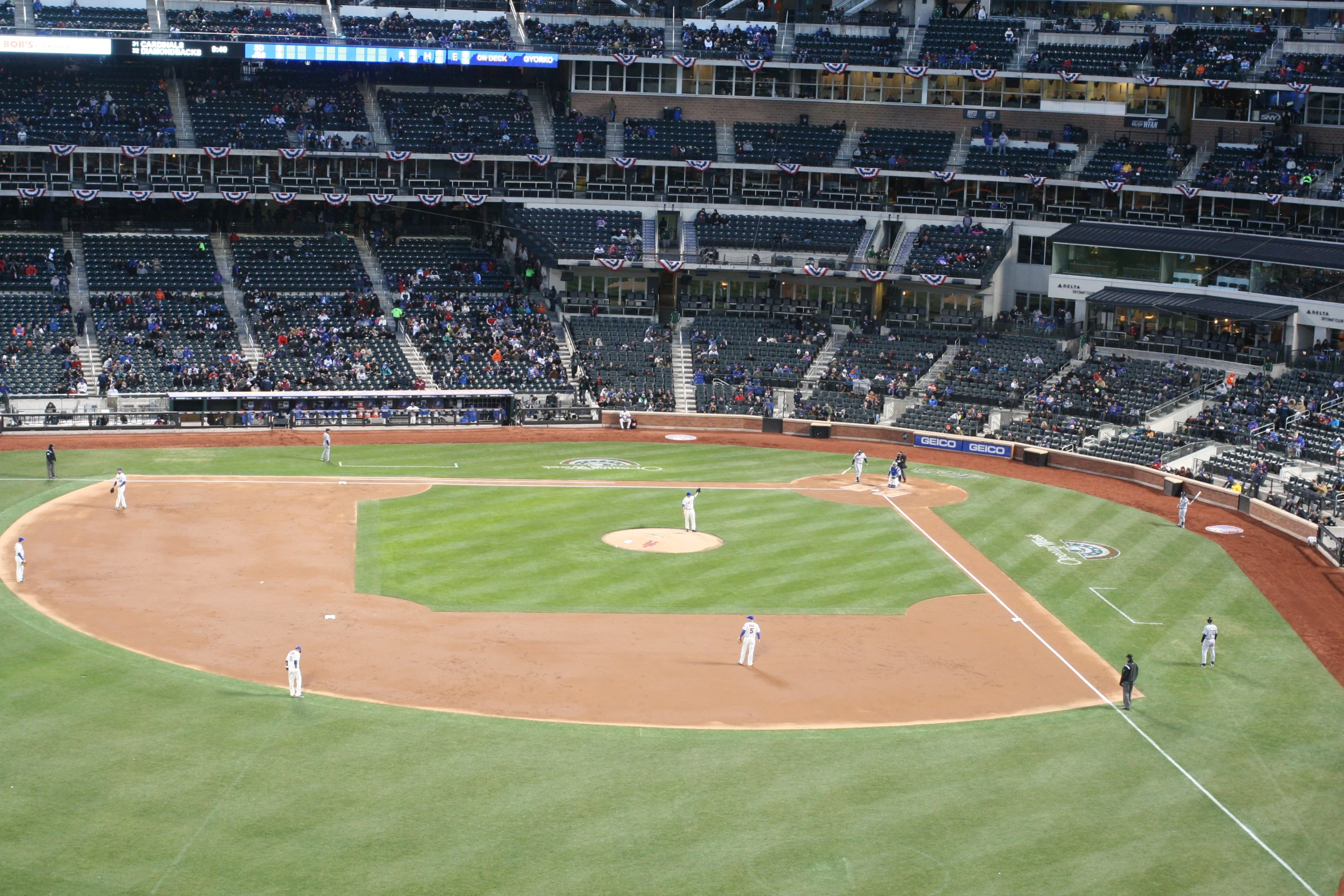 a baseball game with many players on the field