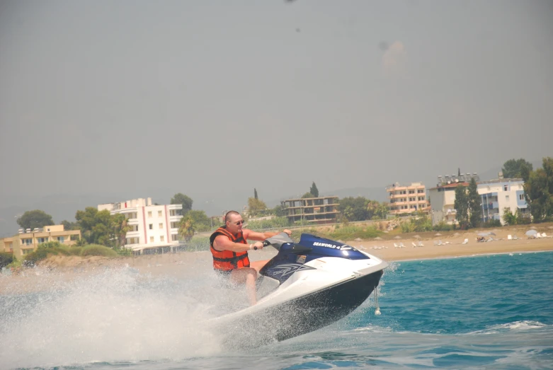 a person on a motor boat in the water