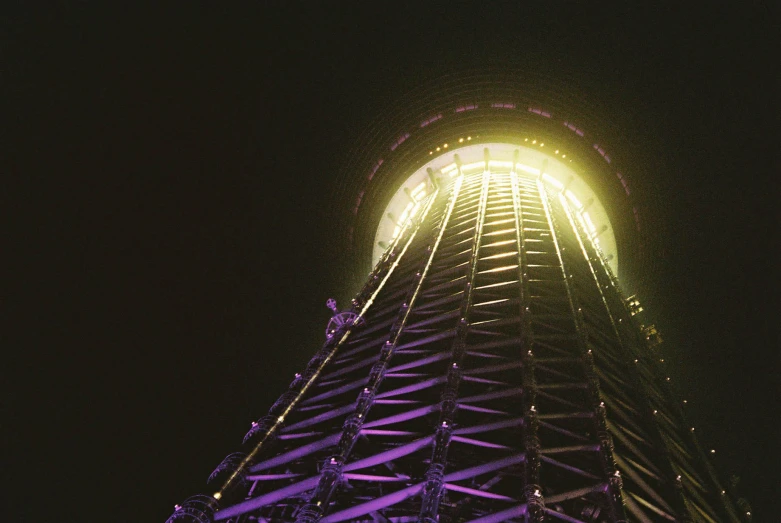 the tower is very high and has lit up lights