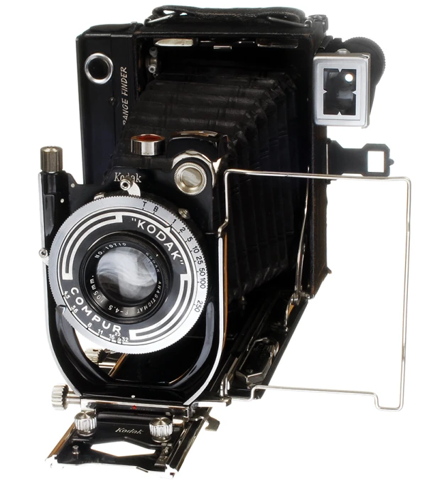 a vintage camera set on a tripod with its glass on