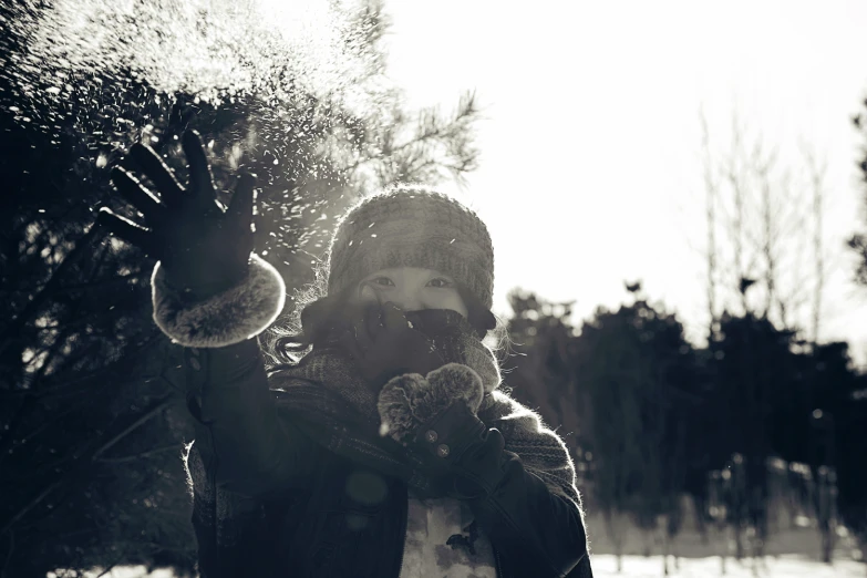 a lady with outstretched arms posing for a po