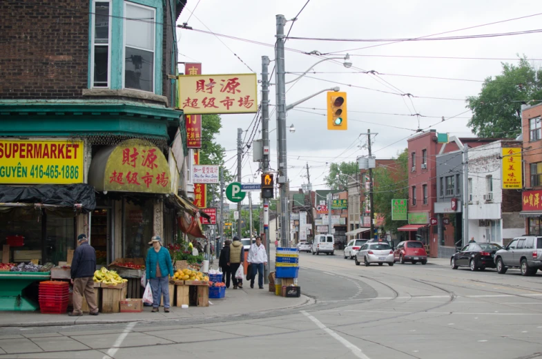 the city street is busy with many shops and small businesses