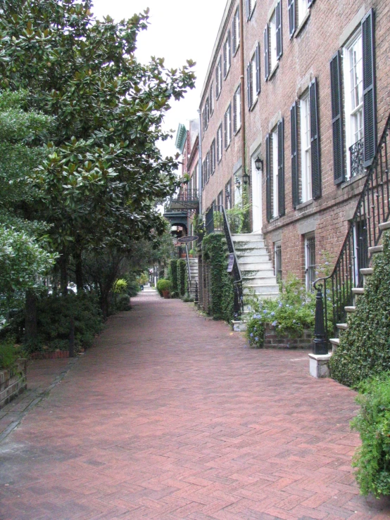 the walkway leads up to the first floor of an apartment building