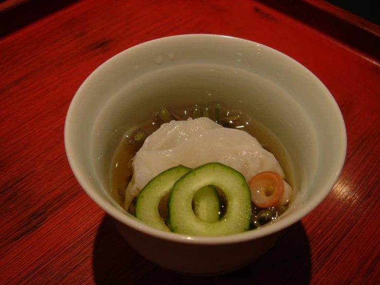 small bowl with food items in it on the table