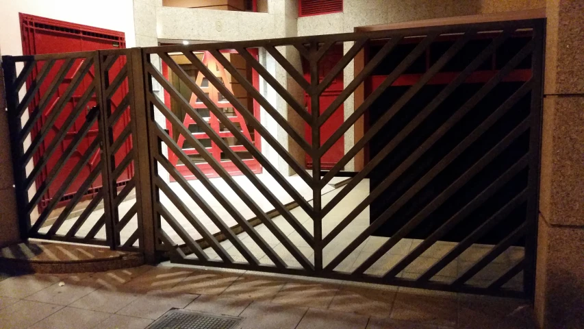 a gate open on the ground with a floor lamp