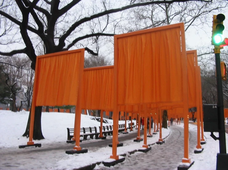 a couple of yellow gates are in the snow